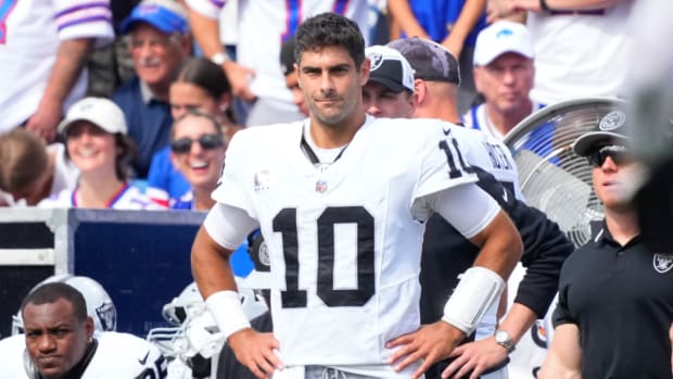 Jimmy Garoppolo stands on the Raiders’ sideline during a game with the Bills.